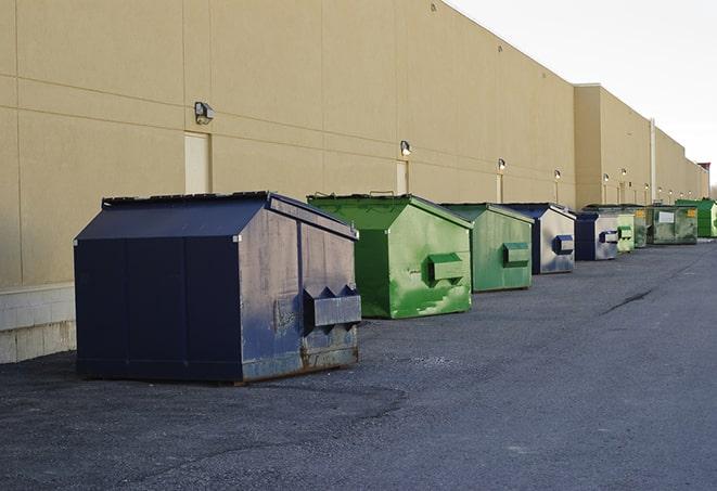 brightly colored dumpsters filled with construction waste in Big Bear City, CA